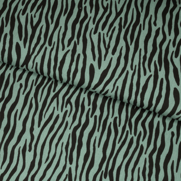 Fast viscose med sorte zebrastriber, der løber på langs, på grøn baggrund