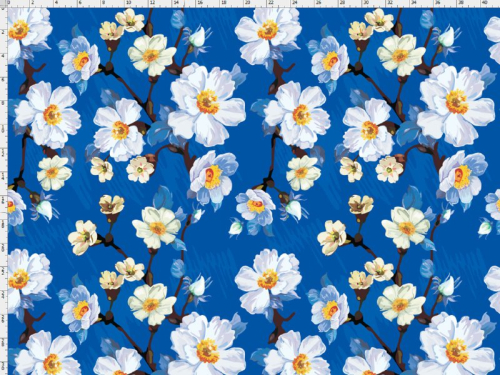 Bomuldsjersey med grene med hvide blomster på klar blå baggrund