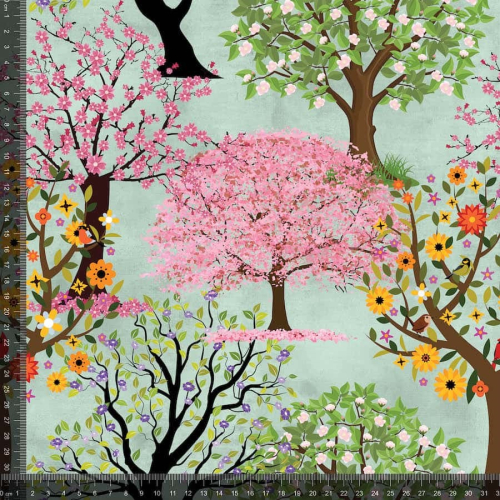 Bomuldsjersey med forårstræer i forskellige farver og små fugle i nogle af træerne på lys grøn baggrund