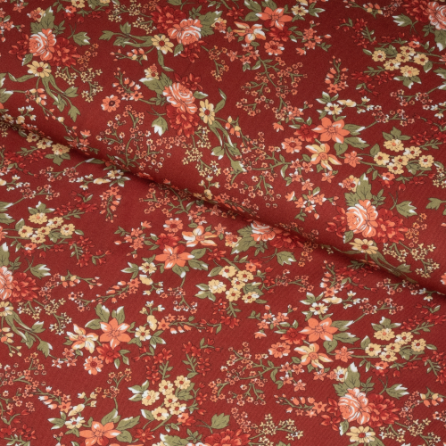 Viscose-twill med små blomster på brændt orange baggrund
